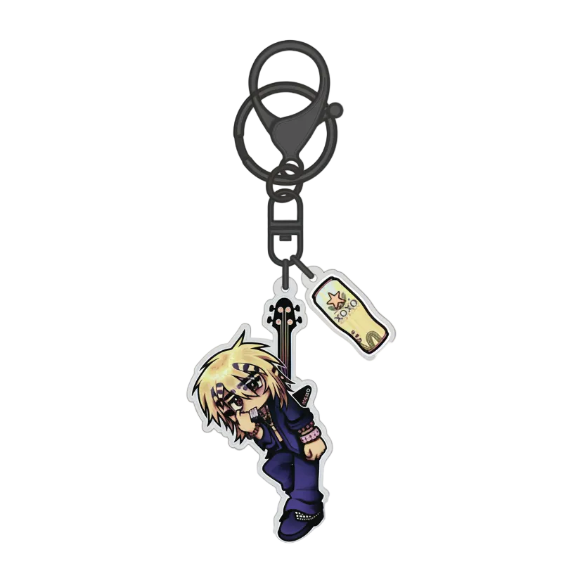 A chibi anime keychain featuring a blonde character with black hair and glasses, holding a black guitar, along with a small rectangular charm, on a black metal keyring and clasp, shown against a plain white background.
